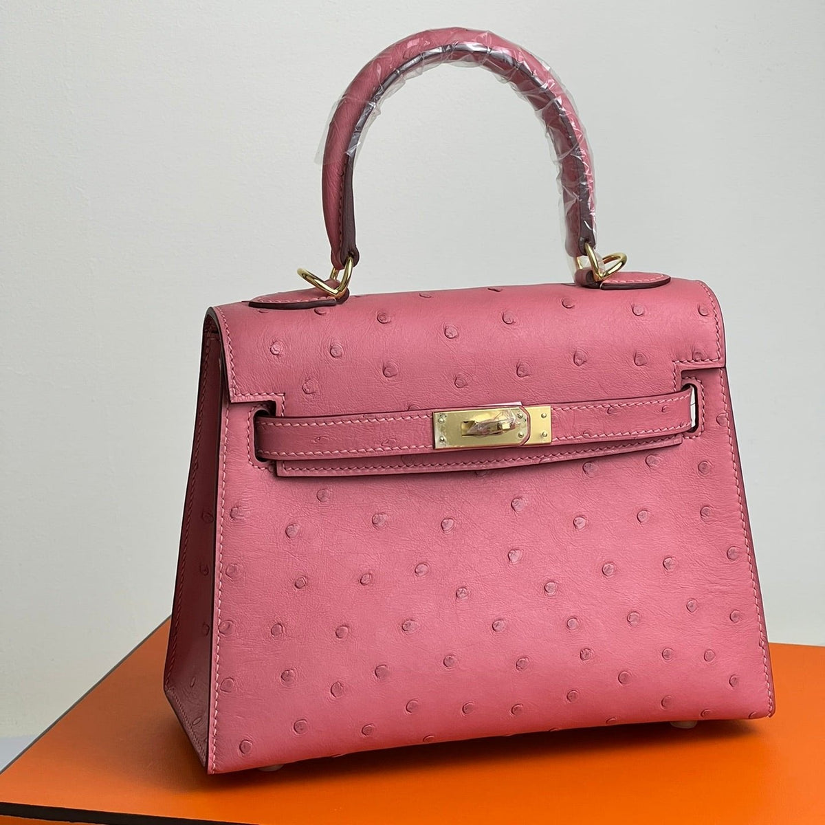 KELLY BAG 20 IN ROUGE PINK OSTRICH LEATHER WITH GOLD HARDWARE (MADE - TO - ODER)