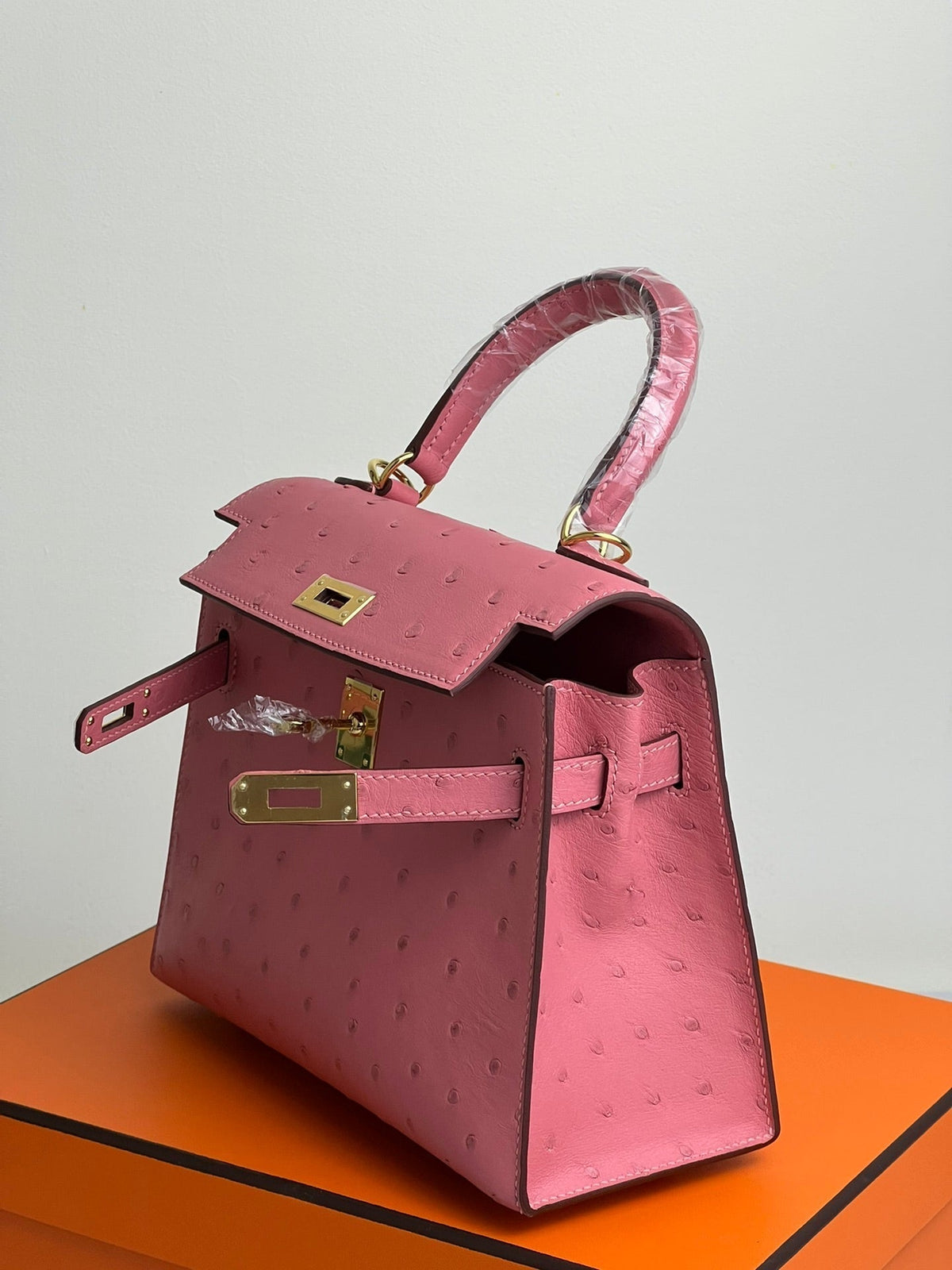 KELLY BAG 20 IN ROUGE PINK OSTRICH LEATHER WITH GOLD HARDWARE (MADE - TO - ODER)