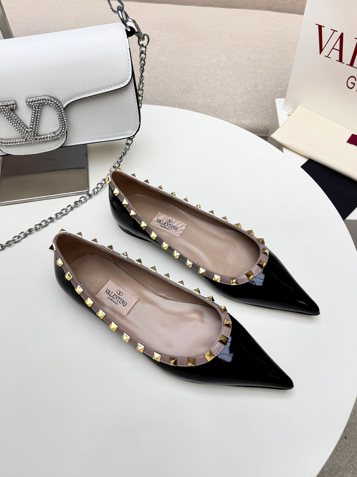 ROCKSTUD FLAT PUMP IN BLACK CALFSKIN