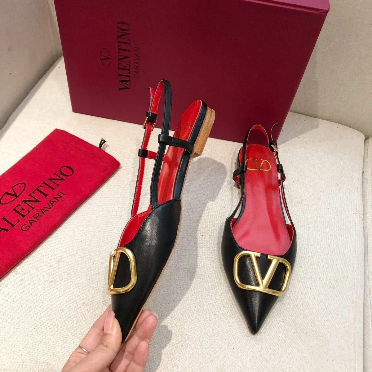 VLOGO SIGNATURE BLACK CALFSKIN FLAT SLINGBACK PUMP WITH GOLD LOGO